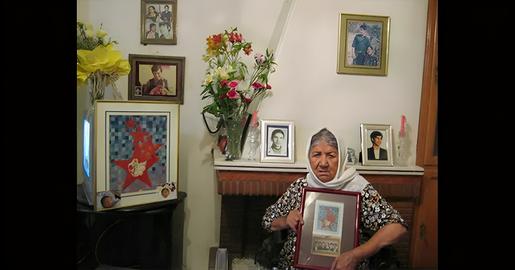 The walls of Mother Behkish’s home were covered with pictures of the loved ones that she lost to mass executions