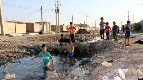 According to an individual residing in the neighborhood, the mounds of dirt created by the water and sewage company to pump water from the septic tank are located right next to a children's playground in the park