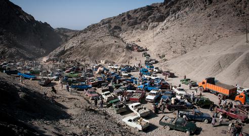 The fuel is unloaded at the border with Pakistan before being transported through the mountains on donkeys
