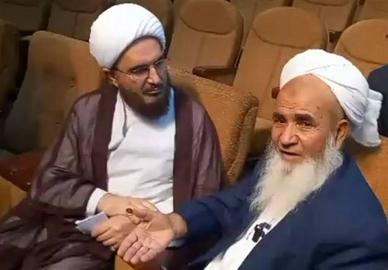 Molavi Abdolvahed Rigi (right), a cleric close to the government who was murdered in December, next to Mohammad Javad Haj Ali Akbari, the supreme leader’s representative, during his recent visit to Sistan and Baluchestan.