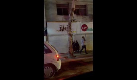 A video from Rasht, Gilan province, a plainclothes security agent was seen carrying a shotgun, on the fifteenth night of protests across Iran