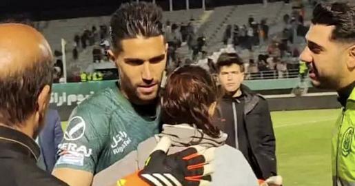 During a match, a woman without a hijab breached security and approached Hosseini on the field