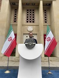 Ali Bahadori Jahromi, the spokesperson for the government of the Islamic Republic of Iran, held a press conference at the former US embassy building in Tehran on October 31, with the national coat of arms of the United States above his head