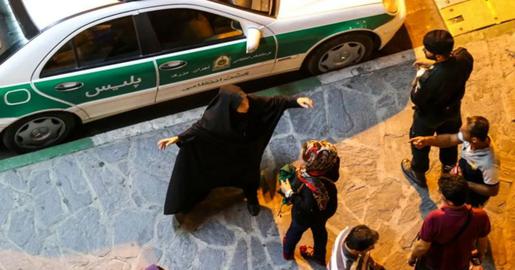 A member of Iran's infamous 'morality patrols' confronts a group of women over hijab
