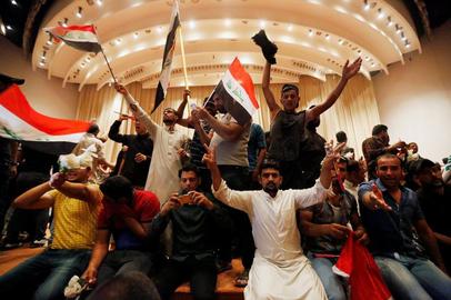 Supporters of Muqtada al-Sadr stormed the Iraqi parliament in Baghdad last night after Shia cleric Muqtada al-Sadr said he was leaving politics, citing pressure from Iran-backed groups