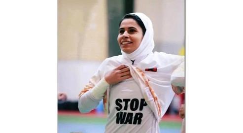 After the match, Kamali lifted up her shirt to reveal an anti-war message emblazoned on a T-shirt underneath