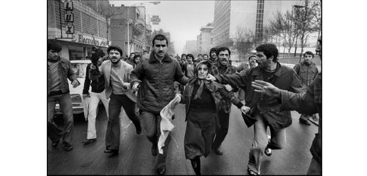 Revolutionaries beat up a supporter of the Shah, Tehran, January 25, 1979