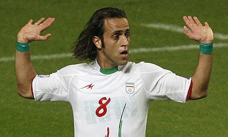 Ali Karimi during Iran's World Cup qualifying match in South Korea, wearing green wristbands to show his support for protesters against the official 2009 results of the presidential election