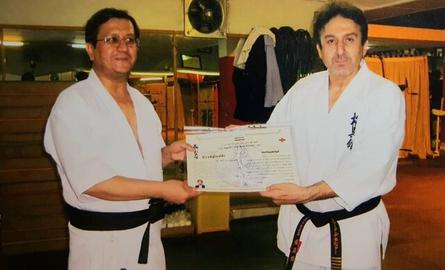Hemmati, left, pictured with his sensei (karate master) Davood Daneshfar