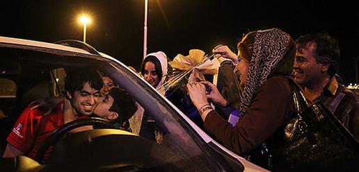 Volleyball team welcomed home by adoring fans