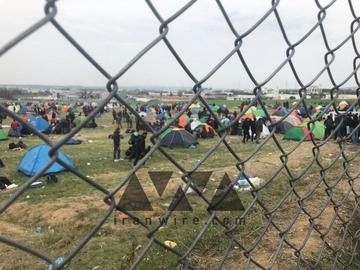 Refugees outside Diavata refugee camp in the Greek city of Thessaloniki near the border with Macedonia