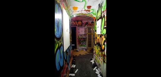 The hallways are covered with graffiti.