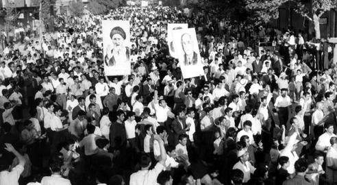 Crowds held banners with photos in support of Kashani (left) and Mossadegh prior to the coup. Later, Kashani withdrew his support for Mossadegh