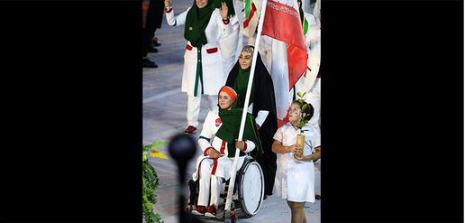 Just for the Show? Disabled athlete Zahrah Nemati carries Iranian flags at the opening ceremonies.