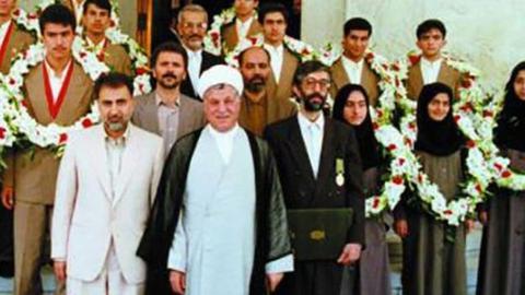 Mirzakhani (third from right) with President Rafsanjani after Winning a Gold Medal from Iran’s Mathematical Olympiad