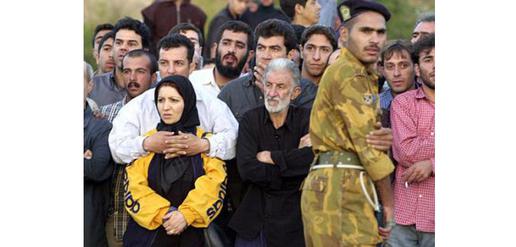 Crowds watch a public execution. Iranian law allows for capital punishment, whipping and stoning for some crimes, which makes joining the ICC problematic for the country.