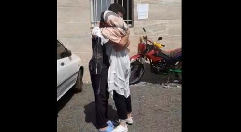 The couple saying goodbye outside the prison