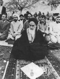 Rouhani (left) behind Ayatollah Khomeini in Neauphle-le-Chateau near Paris in 1978