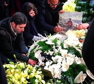 Ramin Seyed-Emami, top of the photo, buries his father Kavous