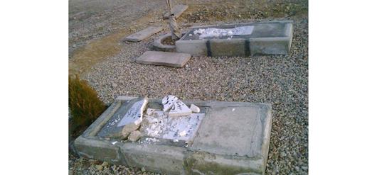 Graves in the Semnan Baha’i cemetery after it was vandalized in February 2009. Approximately 50 gravestones were demolished and the mortuary building was set on fire.