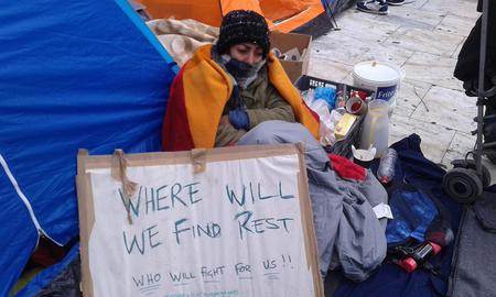 Refugees staged a sit-in outside the Greek parliament in Athens, demanding shelter