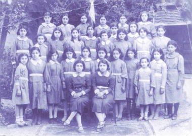 Roshank Nodust, fifth from left, with the staff of Peyk-e Saadat Nesvan School