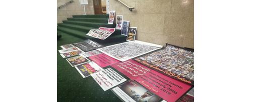 Posters bearing the faces of regime victims old and new lie on the first-floor landing of Church House