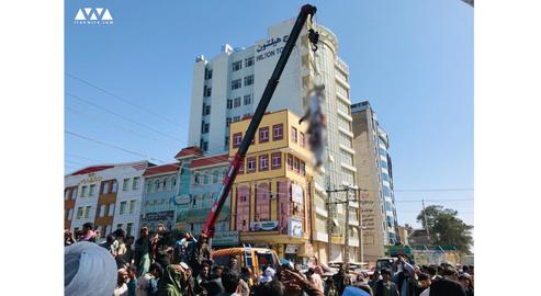 The bodies of four men accused of kidnapping were hung from cranes over public thoroughfares in Herat on Saturday