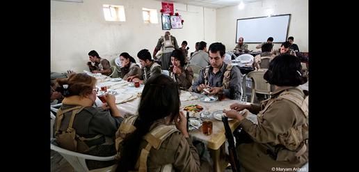 Kurdish Peshmerga having breakfast in a military camp.