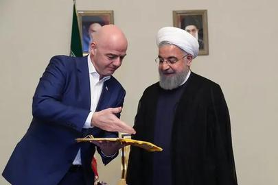 In March 2018 then-President Hassan Rouhani, right, promised FIFA president Gianni Infantino the situation would change