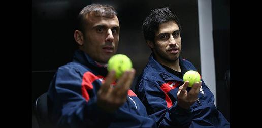 Khosro Heydari (right) holds up one Queiroz’s inspirational tennis balls before the game against Argentina