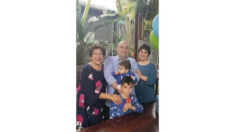 Kiarash, Dr. Parviz Firouzi’s son, with his mother, wife and children