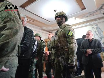 Russian forces and members of the Syrian opposition's Central Committee attend a fruitless negotiation meeting in Daraa, southern Syria