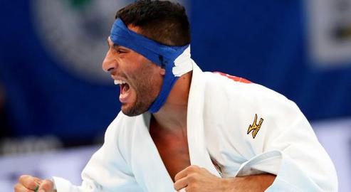 Olympian judoka Saeid Mollaei entered the courtroom under the protection of a Swiss police unit after receiving threats to himself and his family ahead of the hearing