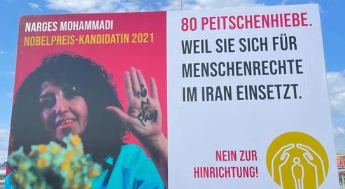 Activist Medics Erect Billboard of Narges Mohammadi on Vienna Highway