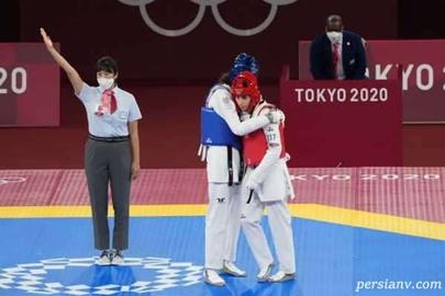 . When she stepped onto the mat, the name on her belt appeared in the three colors of the Iranian flag: green, white and red