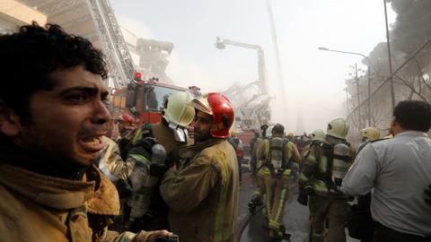 Firefighters at the scene of the collapse