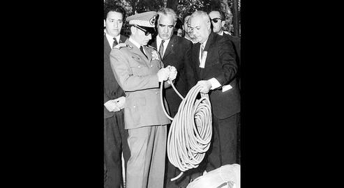 Habib Elghanian  presents the Shah with a plastic hose made in one of his factories.