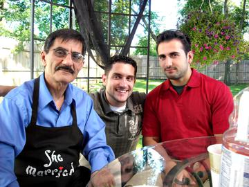 Amir with his father (left) and brother in law Ramy (middle) at a family barbecue