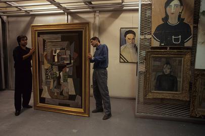 Down in the vaults. A portrait of Ayatollah Khomeini hangs on the wall.