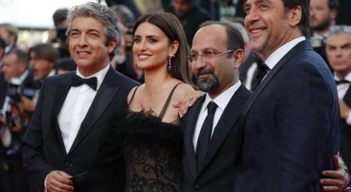 As President Trump made his announcement in Washington, the Cannes Film Festival honored Iranian filmmaker Asghar Farhadi