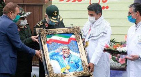 Iran's first gold medal-winner, Javad Foroughi, received a hero's welcome in Iran from colleagues in the IRGC