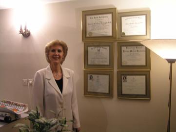 Dr Tahereh Berjis with her qualifications and degrees.