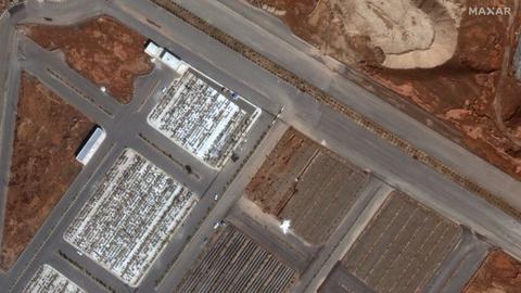Satellite images show freshly-dug mass burial plots at a cemetery in Qom in early March. Picture: Maxar Technologies