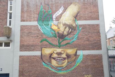 Residents of St. Phillips House, a fourteen-story senior-living facility in Central Harlem, see artist Marthalicia's mural from their balconies