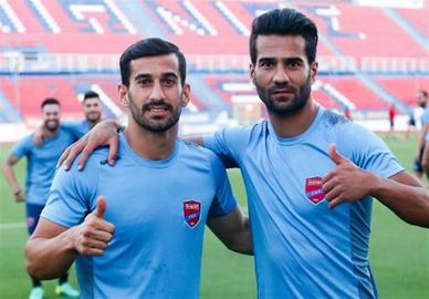 Masoud Shojaei and Ehsan Hajsafi were temporarily suspended after they played against the Israeli team Maccabi as part of their contract with a Greek football team
