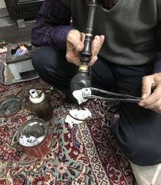 A traditional pipe used for smoking opium.