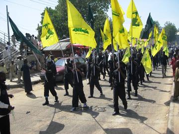 The IMN - pictured here carrying Hezbollah flags at a 2015 Quds Day rally - was branded a "terrorist" entity by Nigerian authorities in 2019
