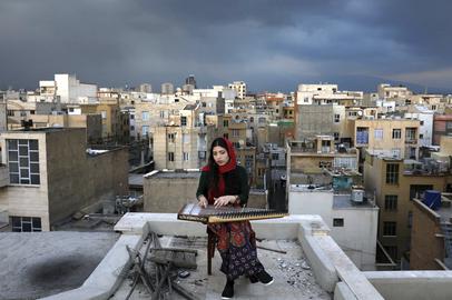 AP PHOTOS: In Iran, isolated musicians perform from rooftops