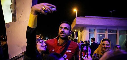 Volleyball team welcomed home by adoring fans